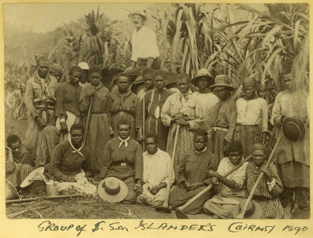 A photograph of a group of South Sea islander workers on a property in Cairns around 1890